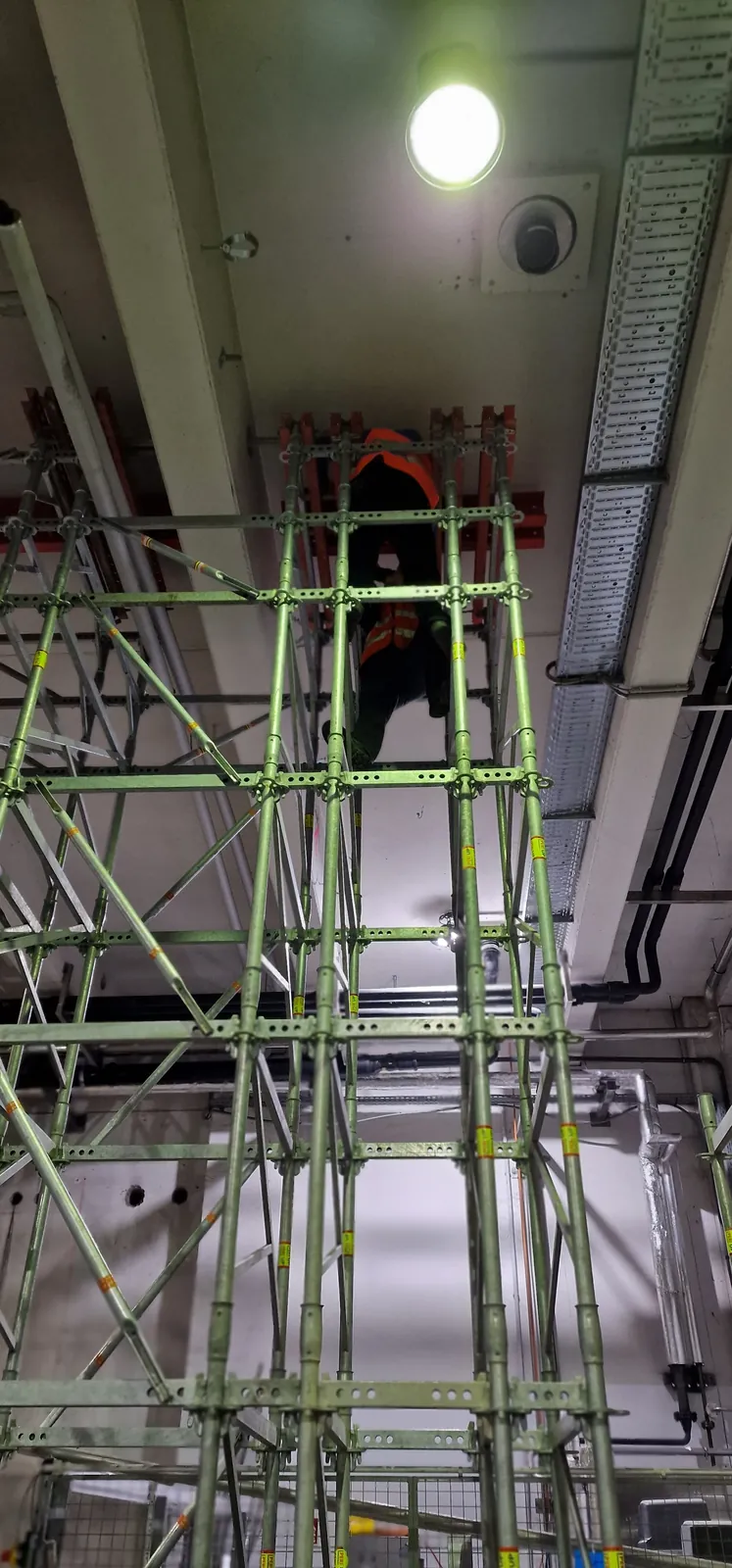 Steel beam propped from below under the slab